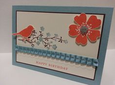 a happy birthday card with two birds and flowers