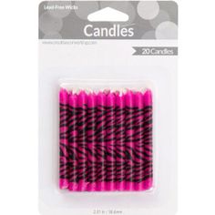 pink and black striped candles in packaging