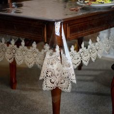 the table is covered with white lace