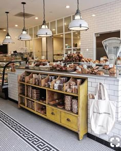 a bakery filled with lots of bread and pastries