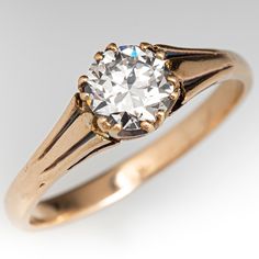 an old - fashioned diamond ring is shown on a white background, with the center stone in