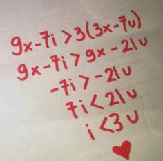 the numbers are written in red ink on a sheet of paper that has hearts drawn on it