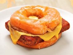 a donut sandwich with meat and cheese on it