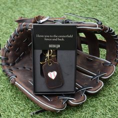 a baseball glove with a tag attached to it