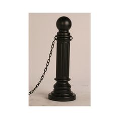 an old fashioned black telephone with a chain attached to the top and bottom of it