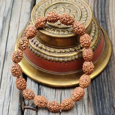 📿Our Four Mukhi Bracelet is handcrafted with Natural 4 Mukhi (Four-Faced) Rudraksha Beads. This Bracelet is essentially for those who seek knowledge, comprehending the essence behind the creation and become more creative. Like the four-faced Lord Brahma, the wearer gains knowledge from all the four cardinal directions. It is suitable for all 4 stages of human life. They are Brahmacharya, Grihastha, Vanaprastha and Sanyasa. The new age contemporary lifestyles require continuous assimilation of k Handmade Spiritual Bracelets For Rituals, Handmade Bracelets For Puja And Festivals, Spiritual Bangle Bracelets For Festivals, Traditional Round Beads Healing Bracelet, Traditional Bracelets With 8mm Beads For Festivals, Traditional 8mm Beaded Bracelets For Festivals, Beaded Bracelets For Meditation And Festivals, Spiritual Beaded Bangle Bracelets For Festivals, Spiritual Beaded Bracelets For Festivals