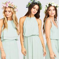 three women in dresses with flower crowns on their heads