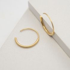 "A timeless classy earrings for a modern style, you can truly wear these gold medium everyday hoops with any outfit and they will look beautiful. Designed from a combination of a half hoop of 2mm soldered to a thiner half hoop of 1mm going through the lobe. Handmade by 22K yellow gold fill over sterling silver (5 micrometers of gold) also available in sterling silver, both matte finished. Hoops measure 22mm in diameter. Post of 19 gauge wire // 1mm diameter This listing is for one pair of earrin Modern Gold-plated Hoop Earrings For Everyday, Minimalist Small Hoop Gold Plated Earrings, Modern Gold Plated Hoop Earrings For Everyday, Modern Everyday Gold Plated Hoop Earrings, Minimalist Open Circle Hoop Earrings For Everyday, Minimalist Everyday Hoop Earrings, Small Hoop Gold Minimalist Earrings, Modern Yellow Gold Open Circle Hoop Earrings, Modern Yellow Gold Open Hoop Earrings