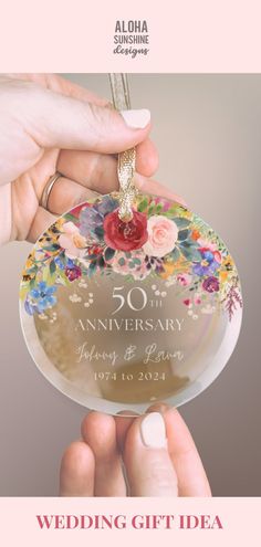 the wedding gift idea for 50 year anniversary is an ornament with flowers on it