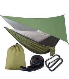 an image of a camping hammock set up with straps and accessories on white background