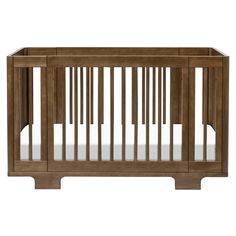 a wooden crib with white sheets on the bottom and sides, in front of a white background