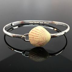 "This sterling silver Scallop Shell Bangle features a silver band with a ridged, silver scallop shell. Available in antiqued sterling silver and sterling with enamel. The bangle accommodates large spacer beads and traditional charms. Marked Brown County Silver and Sterling inside the band. Available in small, medium and large sizes. Small - 6.5\" Medium - 7.25\" Large - 8\" Approximate weight is 13.5 grams See more @ https://www.etsy.com/shop/brocosi" Trendy Silver Shell Jewelry With Oyster Bracelet, Silver Shell Bracelets Gift, Sterling Silver Bracelets For Beach, Adjustable Silver Shell-shaped Jewelry, Mark Brown, Brown County, Jewelry Beach, Scallop Shell, Shell Beach