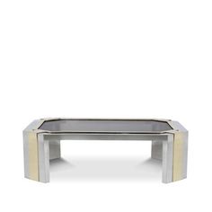 a silver and gold coffee table on a white background