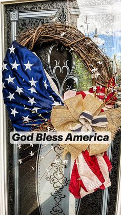 a patriotic wreath with the words god bless america on it