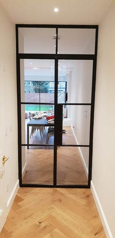 an open door leading to a dining room