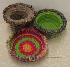 three baskets are sitting next to each other on a table