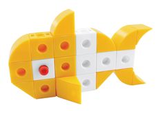 a yellow and white fish made out of lego blocks