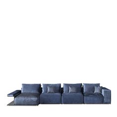 a blue couch sitting on top of a white floor