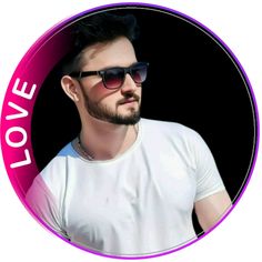 a man wearing sunglasses and a white t - shirt with the word love on it