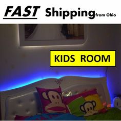 a kid's room with monkey pillows and neon lights on the headboard is featured in this ad for fast shipping from ohio