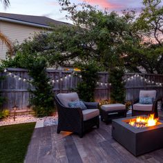 a fire pit sitting on top of a wooden deck