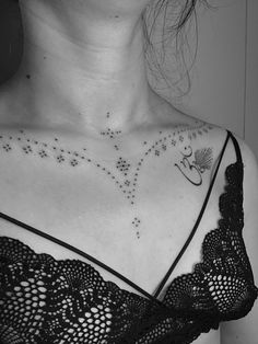 a woman with a tattoo on her chest