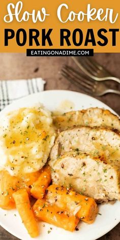 slow cooker pork roast with potatoes and carrots on a white plate