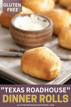 a tray with rolls on top of it next to a bowl of ranch dips