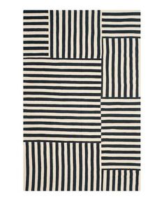 a black and white rug with stripes on it