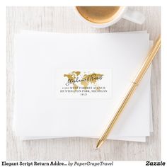 a cup of coffee, pen and envelope on a white table with gold foil stamp