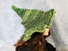 "This custom color forest witch hat is firmly shaped but soft enough to fold for travel. The brim is naturally wavy, but you can still play with where you want the waves to be exaggerated. The tip is sewn with a tuck to keep the point crooked, and the double thick yarn makes this hat firm enough to hang from a peg or sit on your dresser. You can add your own seasonal touch with pins, buttons, beads, flowers, etc through the crocheted stitching. This hat will take you through Fall, Winter, and Sp Handmade Witchy Hat With Curved Brim, Handmade Witchy Wide Brim Hat, Handmade Wide Brim Witchy Hat, Green Bohemian Brimmed Sun Hat, Green Brimmed Sun Hat For Festival, Green Crochet Hat For Outdoors, Green Crochet Hat For Outdoor, Green Sun Hat For Festivals, Bohemian Green Sun Hat With Short Brim