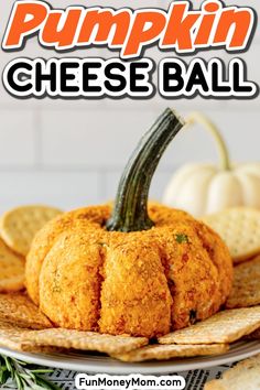 pumpkin cheese ball on a plate with crackers