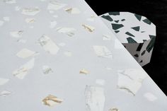 the table is covered with pieces of white marble