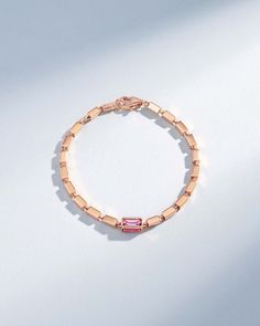 Crafted with solid 18-karat gold, this block-chain bracelet presents a symphony of four-sided links. It features four pink sapphire baguettes set in one link encased by a golden frame. The thick, block-chains add a contemporary edge to the timeless design making it perfect for casual or evening wear. Details 18k rose gold or yellow gold 1.40 carats of pink sapphire baguettes 7" inch bracelet is adjustable at 6.5" inches 8" inch bracelet is adjustable at 7.5" inches Model is styling 7" bracelet i Luxury Rose Gold Bracelet With Rectangular Links, Formal Rose Gold Baguette Jewelry, Elegant Pink Sapphire Baguette-cut Jewelry, Elegant Pink Sapphire Jewelry Baguette Cut, Rose Gold Rectangular Jewelry With Bracelet Strap, Rose Gold Rectangular Bracelet Jewelry, Pink 14k Gold Baguette Cut Jewelry, Fine Jewelry Gold Bracelet With Rectangular Links, Pink Bracelet Strap Jewelry For Formal Occasions