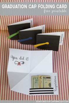 an origami graduation cap folding card is shown with some money in the envelope