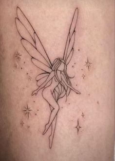 a woman's thigh with a fairy tattoo on it