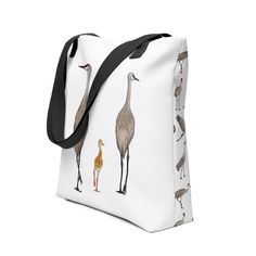 *Print on demand* This tote bags features Sandhill Cranes. The tote bag is custom made through print on demand company Printful, who will print, cut, sew, and ship your order! The fabric is printed using the sublimation technique which results in a unique all over design. • 100% spun polyester fabric • Bag size: 15” × 15” • Capacity: 2.6 US gal • Maximum weight limit: 44lbs (20 kg) • Dual handles made from 100% natural cotton bull denim • Handle length 11.8”, width 1” • Cotton webbing handles ca Sandhill Cranes, All Over Design, The Tote Bag, Fabric Bag, Black Tote Bag, Custom Items, Natural Cotton, Tote Bags, Print On Demand