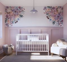 a baby's room with pink walls and floral wallpaper on the walls, a white crib in the foreground