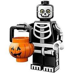 a lego skeleton holding a pumpkin bucket with a jack - o'- lantern on it