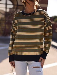 Get ready to harvest some compliments with our Harvest Stripes Sweater. Perfect for casual cute style, this sweater will keep you cozy while adding a touch of playful charm to your look. Ready to wear to your next pumpkin patch adventure or cozy night in. (Sweaters look good on pumpkins too!) Fabric 50% rayon, 28% nylon, 22% polyester Comfy Crew Sweater, Comfy Cozy Crew Sweater, Comfy Cozy Fit Crew Sweater, Cozy Striped Sweater For Layering, Trendy Green Fall Sweater, Cozy Striped Sweater For Fall, Oversized Crew Sweater For Fall, Cute Crew Neck Sweater With Ribbed Cuffs, Striped Long Sleeve Sweater For Loungewear