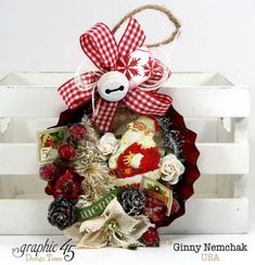 a christmas wreath with a teddy bear on it