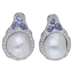 Luxury Pear-shaped Diamond Earrings With Gemstones, Luxury Pear-shaped Gemstone Diamond Earrings, Luxury Tanzanite Earrings With Gemstone, Luxury Tanzanite Gemstone Earrings, Luxury Tanzanite Earrings, Evening Round Diamond Earrings With Gemstone, Evening Diamond Round Earrings, Evening Diamond Earrings With Gemstone, Gemstone Diamond Earrings For Evening