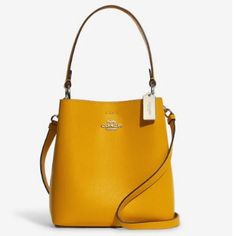 Our Polished Pebble Leather Small Town Bucket Bag Is An Essential Style With A Long Detachable Crossbody Strap And A Top Handle For Versatile Wear. Double Face Leather Center Zip Compartment Snap Closure Handle With 6 3/4" Drop Detachable Strap With 22" Drop For Shoulder Or Crossbody Wear 8 1/2" (L) X 8 3/4" (H) X 4" (W) 100% Authentic, Nwt Color: Ochre/Wine Please See Pictures For Reference Coach Saddle Bag, Coach Rogue, Coach Crossbody Purse, Brown Cowhide, Bags Coach, Coach Outlet, Coach Gifts, Gold Orange, Crossbody Messenger Bag