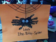 a child's handprint on a paper sign that says lylla's itsy - bitsy - spider