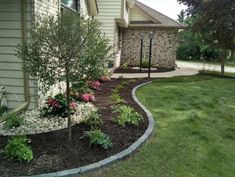 a house with landscaping in the front yard