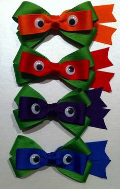 four different colored bows with googly eyes