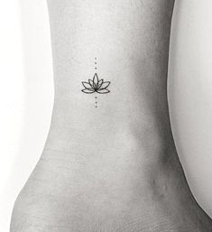 a lotus flower tattoo on the ankle