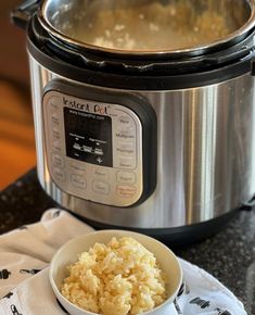 rice in a bowl next to an instant pot