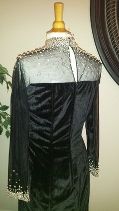 We have this gown in stock in a size 10.  This dress can be shipped today! Black Velvet Gown, Velvet Evening Gown, Special Occasion Gowns, Velvet Gown, Long Sleeve Evening Dresses, Pageant Gowns, Fashion Website, High Collar, Evening Wear