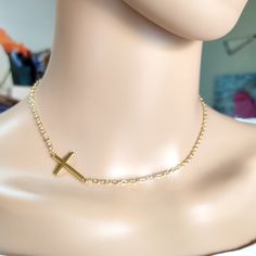 Cross gold steel necklace, Layering jewelry, Religion cross choker, Gold necklace, Minimalist jewelry, Dainty cross choker, Tiny necklace Beautiful simple necklace with gold stainless steel cross and steel chain. Simple choker or everyday wear Length 42cm  The necklace will be delivered inside a craft jewelry box. JEWELRY CARE: Please take care of your jewelry do not wear in the shower, swimming pool, or to bed. Keep away from harsh chemicals and cleaners. It is always best to put on your jewelry on after applying lotions, hair sprays and make-up. Remember to always remove your jewelry before doing any activity that could cause damage to your jewelry. more necklaces https://www.etsy.com/shop/artncreate?ref=seller-platform-mcnav§ion_id=14284001 Thanks for visiting! Minimalist Cross Chain Necklace With Delicate Chain, Minimalist Delicate Chain Cross Necklace, Minimalist Gold Crucifix Jewelry, Minimalist Crucifix Jewelry With Delicate Chain, Adjustable Gold Cross Pendant Necklace, Minimalist Gold Chain Necklace With Cross Pendant, Minimalist Clavicle Cross Chain Jewelry, Minimalist Crucifix Necklace With Adjustable Chain, Minimalist Crucifix Jewelry With Adjustable Chain